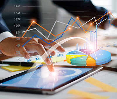 Businessman using tablet and laptop analyzing sales data and economic growth graph chart. Business strategy. Digital marketing. Business innovation technology concept